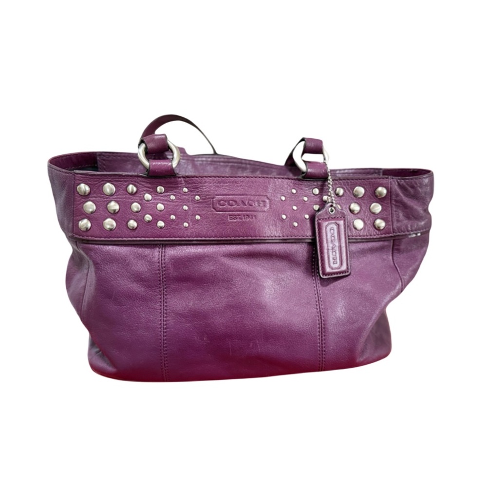 Purple Coach leather handbag.